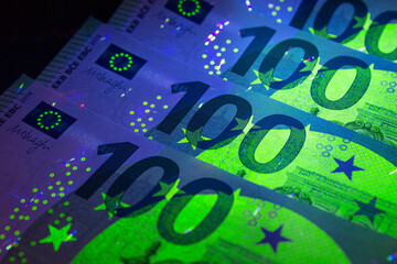 Euro currency in UV light protection.Euro in UV light.Euro currency in UV light protection.