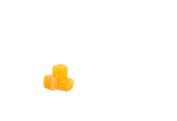Cube of orange turkish delight on a white background