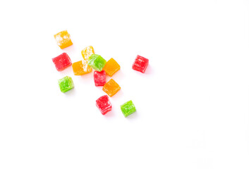 Multicolored cubes of rahat Turkish delight on a white background