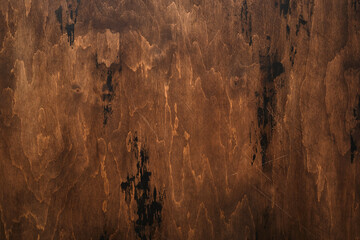 Fototapeta premium Brown scratched wooden background. Wood texture.