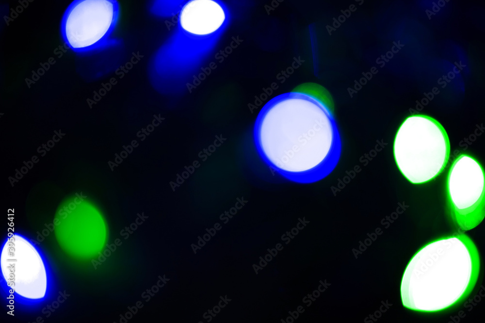 Wall mural Abstract bokeh background wallpaper. colorful lights on a black background