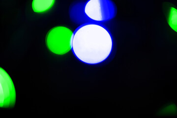 Abstract bokeh background wallpaper. colorful lights on a black background