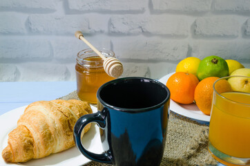 Still life with fresh fruits and glass of juice on the wooden background