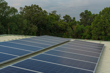 solar cells panel installed on the roof of a large building are full of dirt and dust.