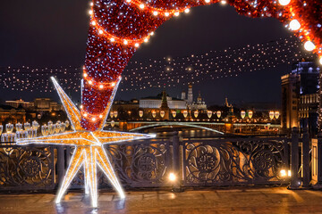 Christmas decorations with New Year's lights overlooking the Moscow Kremlin.