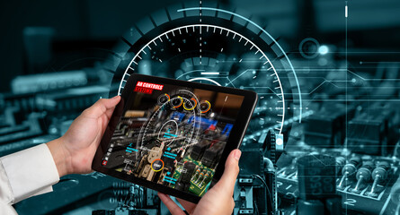 Engineer use augmented reality software in smart factory production line with automated application...