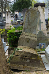 A very slanted gravestone at the P&egrave;re Lachaise cemetery in Paris.
