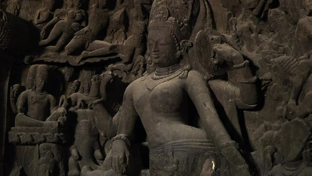 Ancient sculptures at Elephanta Caves, a collection of cave temples predominantly dedicated to the Hindu god Shiva on Elephanta Island in Mumbai, Maharashtra, India.
