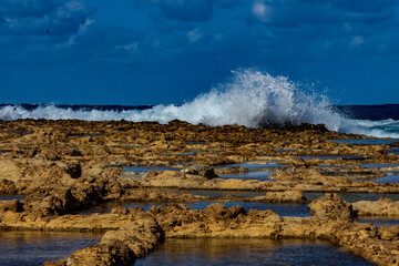 Wave hitting the Xwejni Salt Pans in Żebbuġ, Gozo.