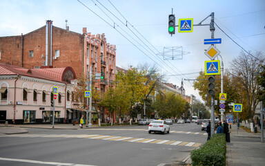 Fototapeta na wymiar Autumn has come to the city.Pedestrians and vehicles move along the street Bolshaya Sadovaya
