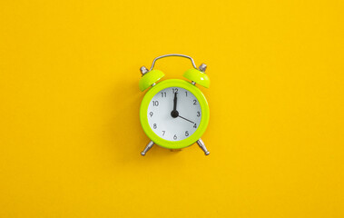 Alarm clock on a color background.