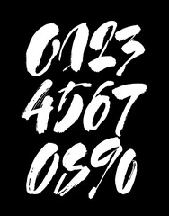 set of calligraphic acrylic or ink numbers. ABC for your design, brush lettering on a black background