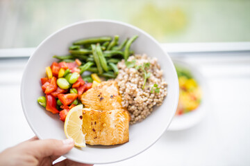 Salmon and buckwheat dish with green beans and tomato