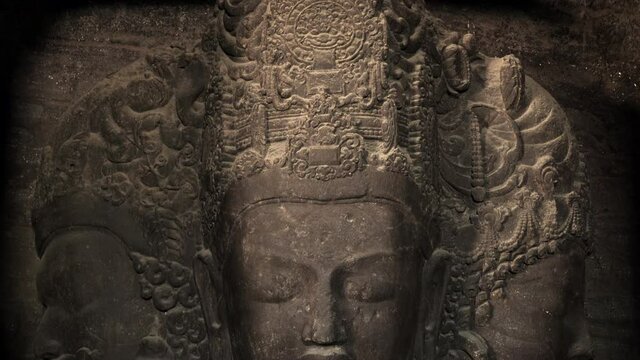 The ancient 6-metre (20 ft) high Trimurti sculpture at Elephanta Caves, a collection of cave temples predominantly dedicated to the Hindu god Shiva on Elephanta Island in Mumbai, Maharashtra, India.