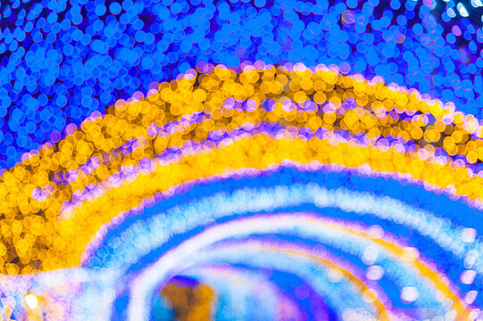 Colorful light tunnel bokeh and Christmas tree background, light abstract art, celebrate festival season..Colorful decoration of many LED light. Winter season elegant bokeh background.