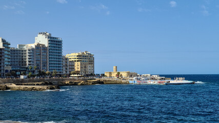 Fototapeta premium The seafront with the Sliema point battery, Sliema, Malta.