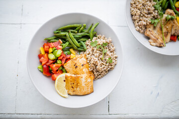 Salmon and buckwheat dish with green beans and tomato