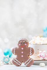 Homemade christmas gingerbread man cookies and cup of hot chocolate with marshmallow.Traditional Christmas food.