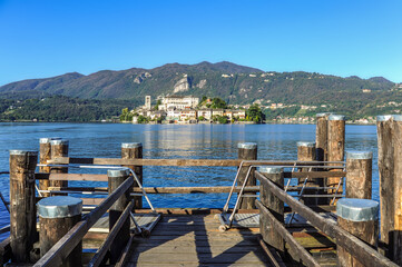 The island of San Giulio on Lake Lago d, Orta is famous for the Basilica of St. Julius with frescoes from the 14th to 16th centuries and the only street of Silence that encircles the entire island.   