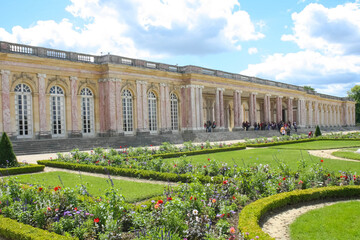 the grand trianon palace in versailles park