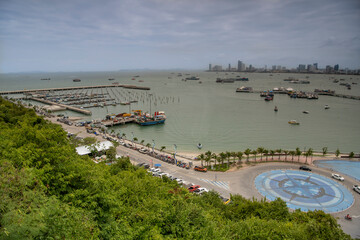   View of the Gulf of Siam and the city.Tourists walk along the promenade