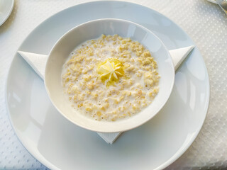 Oatmeal for Breakfast in a bowl from above, beautiful dish setting, still life, healthy lifestyle, healthy eating, diet, fitness and vegetarian food concept