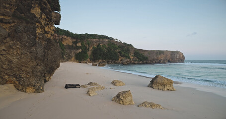 Sand beach at rock ocean coast wavesaerial view. Nobody tropic nature seascape of cliff seashore...