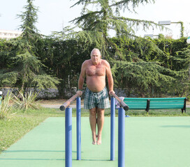 Fototapeta premium Senior adult engaged in outdoor exercise, physical activity, healthy lifestyle