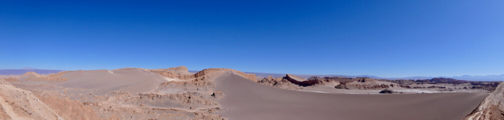 Panorama of dark sand dune, Valley of the moon in Atacama salt desert, Chile