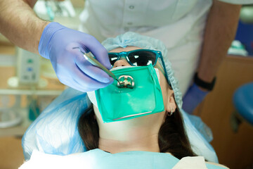Young woman at the dentist appointment. Doctor's appointment. Dental treatment.