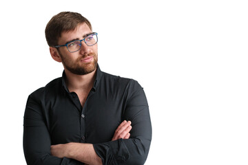 Handsome bearded glasses man in a black shirt on the isolated background. Portrait of young serious businessman