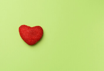 red heart on a green background