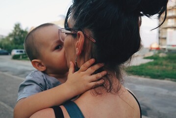 Fototapeta premium parent kissing their child