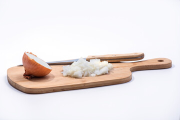 Chopped and half onion on a wooden cutting board isolated on white background