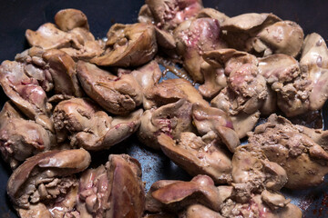 Cooking fried liver in a frying pan close-up. selective focus