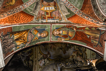Naklejka premium Italy / San Giulio Island 09/13/2014 Most of the surviving frescoes are made by Sperindio Cagnola, who belonged to the Lombard school of artists and was influenced by Gaudenzio Ferrari. 