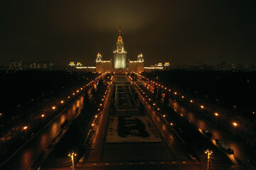 Fototapeta premium a panoramic view of the night city from a bird's eye view shot from a drone