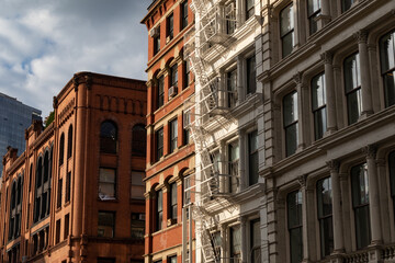 Fototapeta na wymiar SoHo New York City Street with Beautiful Old Buildings with Fire Escapes