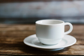 Obraz premium Chrysanthemum tea in cup over the old wooden table background . selective focus