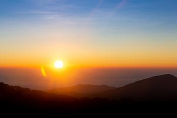 Beautiful sunrise with bright colors and mountains.