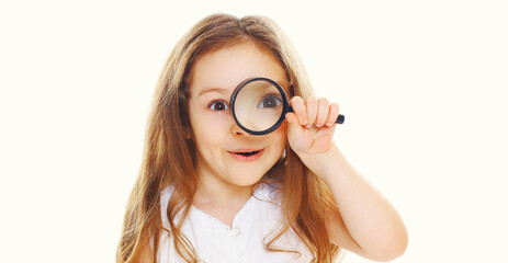 Cute child looking through magnifying glass isolated on a white background