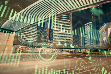 Double exposure of technology theme hologram and cityscape background. Concept of Hightech.