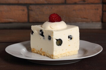 Frozen cheesecake with blueberry and raspberry