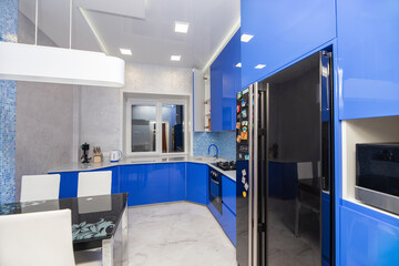 varnished kitchen interior in blue colors. real interior design