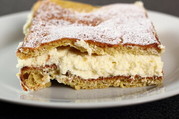 Karpatka. Traditional Polish Cream Pie filled with pudding cream.