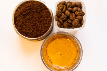Espresso with ground coffee and whole coffee beans