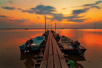 A scenic beauty of traditional fishing boat with sunset at Teluk Sengat,Johore, Malaysia with Soft focus due to long exposure