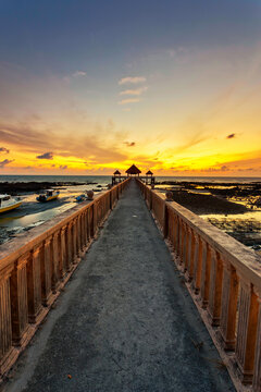 A long exposure picture of majestic sunrise with a jetty as a background at Tanjung Balau, Johore
