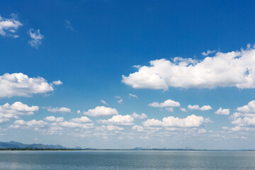 Obraz premium Blue sky and white clouds and river. Nature weather