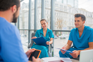 Medical workers having a changeover and talking